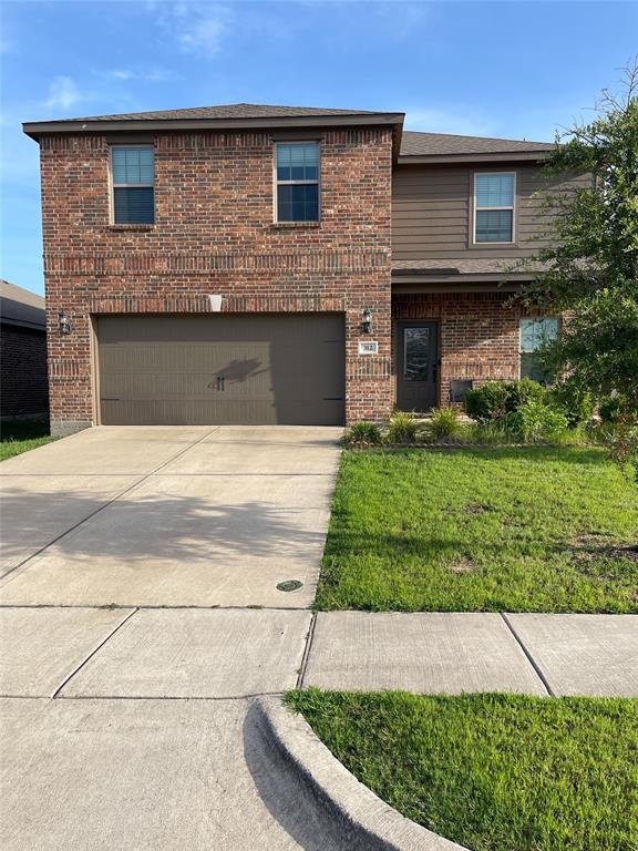 312 Ryan Street Anna, TX 75409 - Photo 1 of 1 a front view of a house with a yard and garage