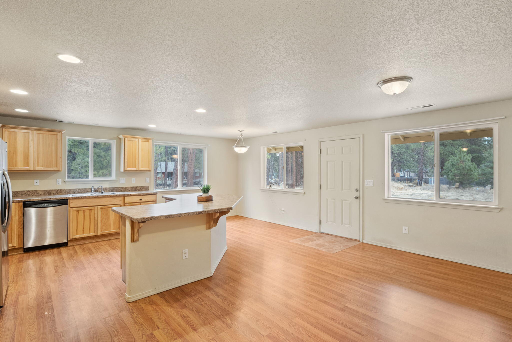 59674 Navajo Road Bend, OR 97702 - Photo 14 of 47 Kitchen, dining area, backdoor exit, great room feel.