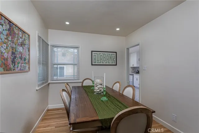 a bedroom with a bed table and chair