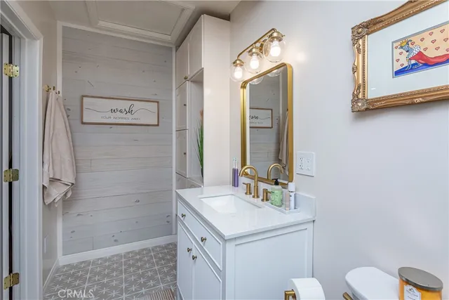 a view of a patio with table and chairs under an umbrella