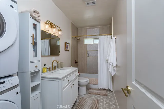 a view of a patio with a dining table and chairs