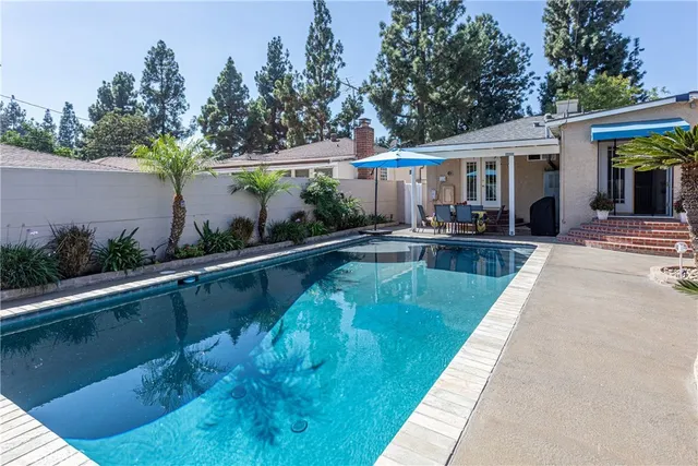 an aerial view of a house with outdoor space
