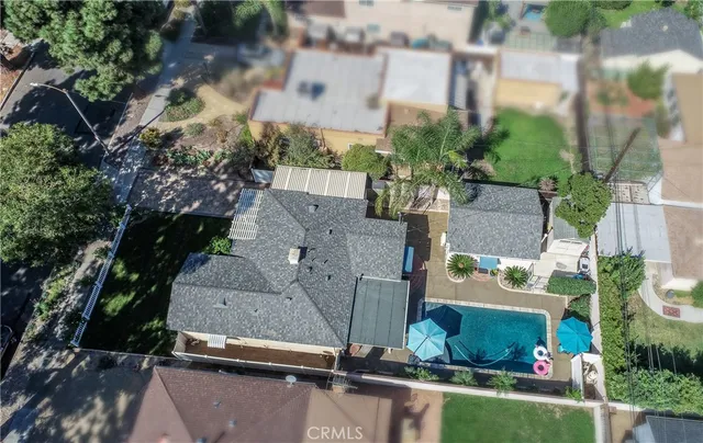 a kitchen with stainless steel appliances a sink cabinets and wooden floor