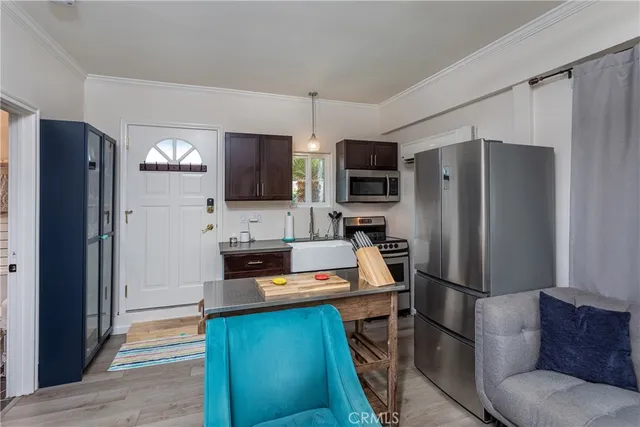 a kitchen with a stove and a microwave