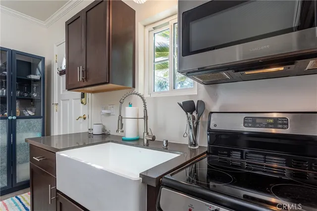 a bathroom with a sink vanity and mirror