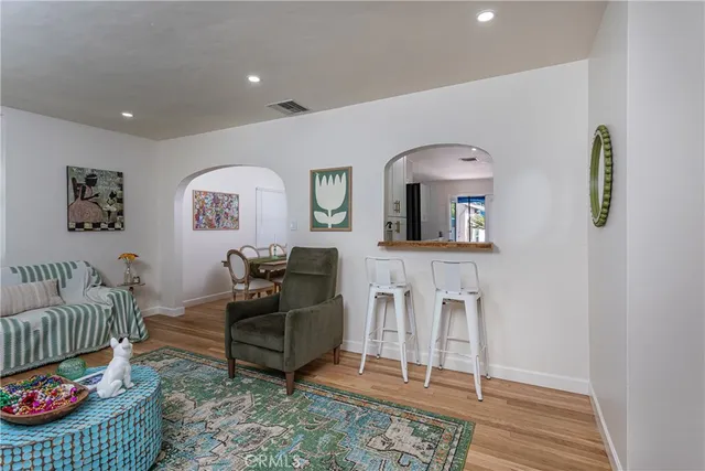 a living room with furniture and a rug