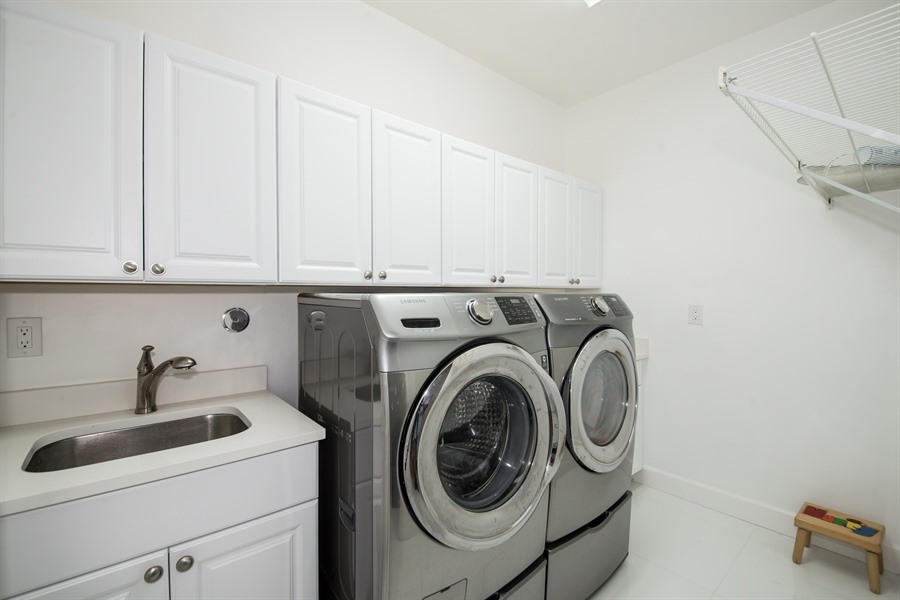 7256 Mandarin Drive Boca Raton, FL 33433 - Photo 14 of 18 14_7256MandarinDr_44_LaundryRoom_LowRes