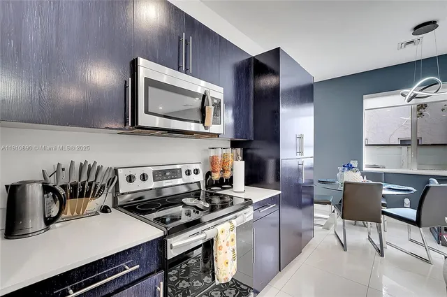 a kitchen with a stove and a microwave