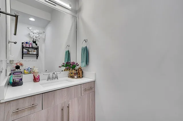a bathroom with a sink and a mirror