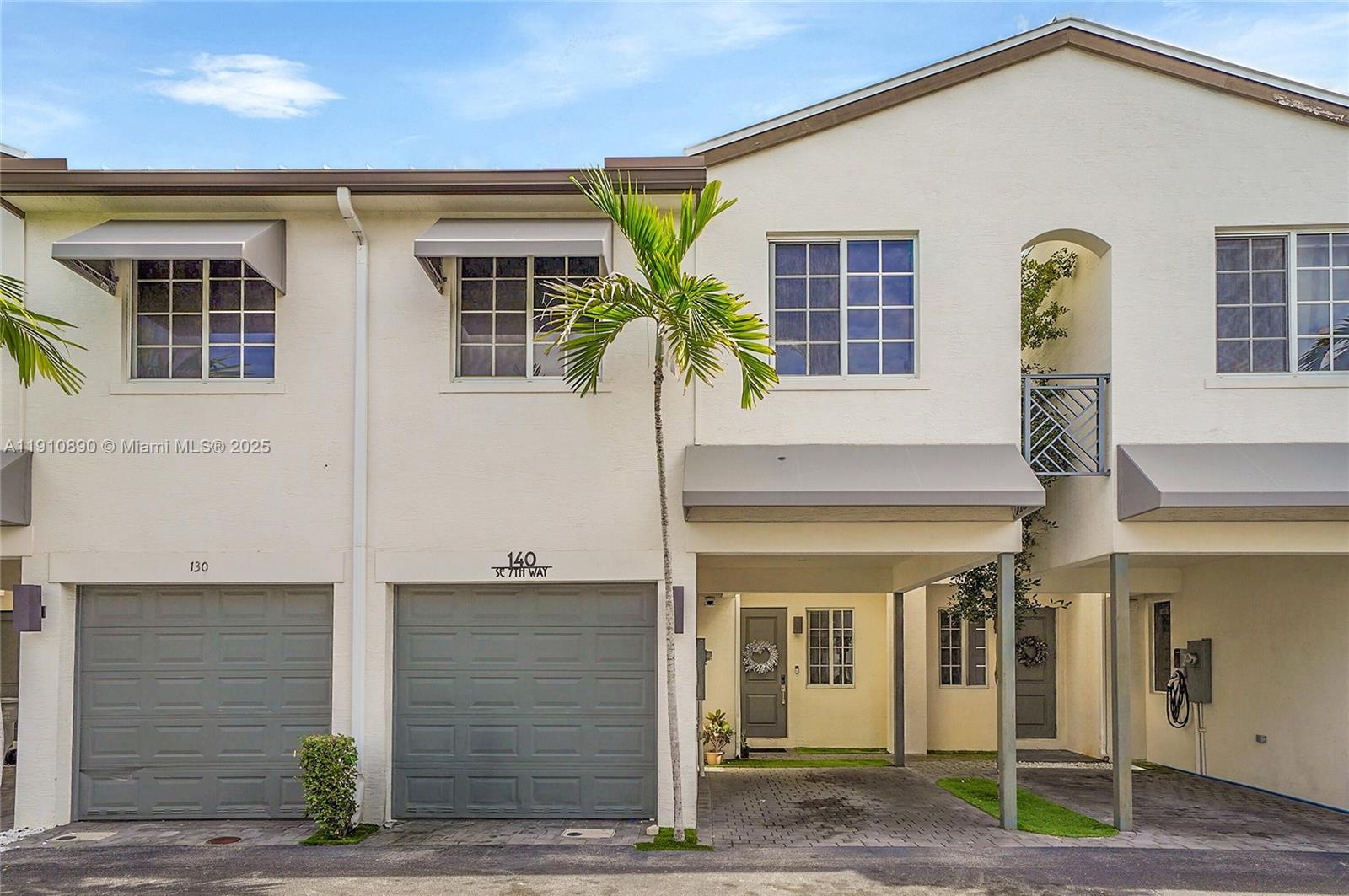 140 South E 7th Way Pompano Beach, FL 33060 - Photo 2 of 40 a front view of a house with glass windows