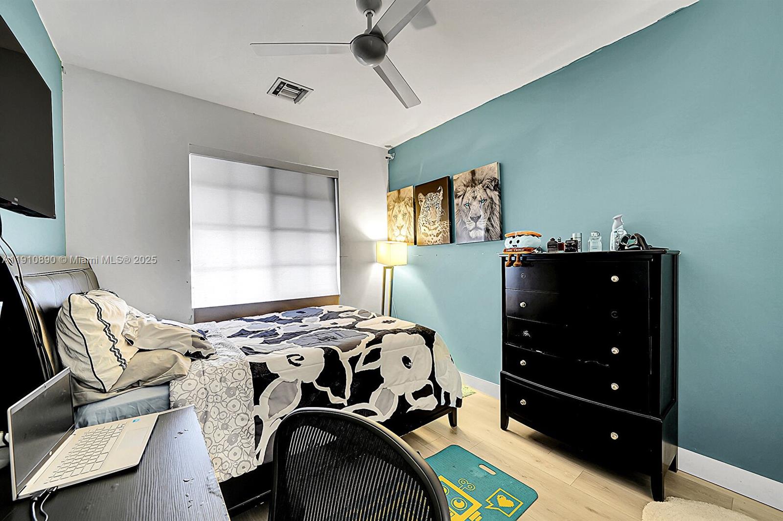 140 South E 7th Way Pompano Beach, FL 33060 - Photo 22 of 40 a bedroom with a bed and furniture