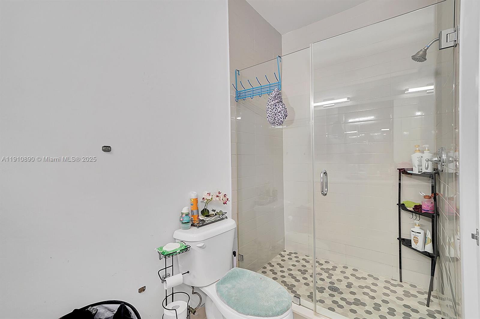 140 South E 7th Way Pompano Beach, FL 33060 - Photo 26 of 40 a bathroom with a sink a toilet and shower