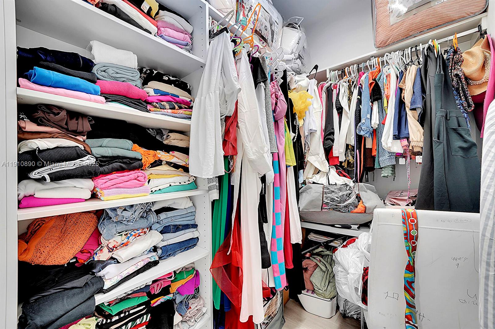140 South E 7th Way Pompano Beach, FL 33060 - Photo 32 of 40 a view of walk in closet with clothes and shoes