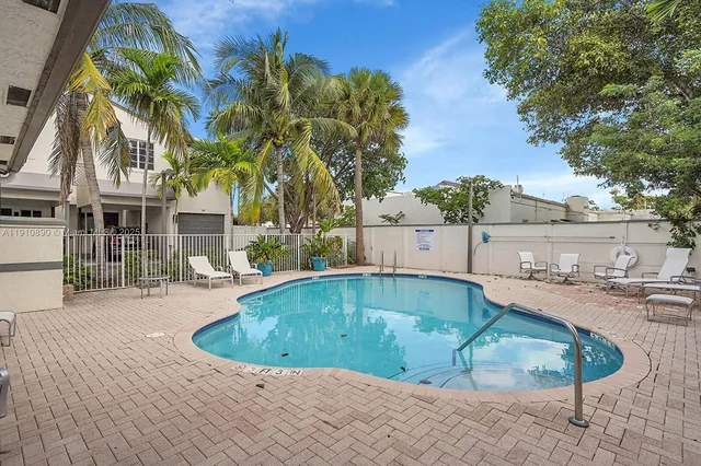 a view of a swimming pool with a patio