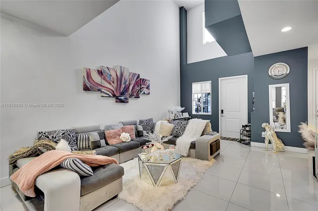 a living room with furniture and balcony