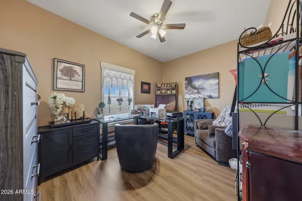 a living room with lots of furniture and a lamp