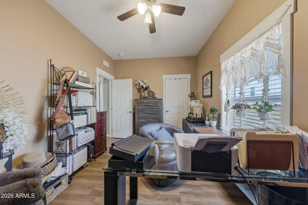 a view of a livingroom with furniture and a ceiling fan