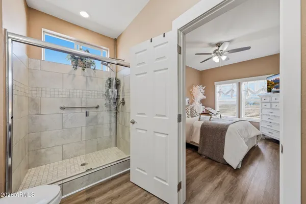 a bedroom with a bed and a window