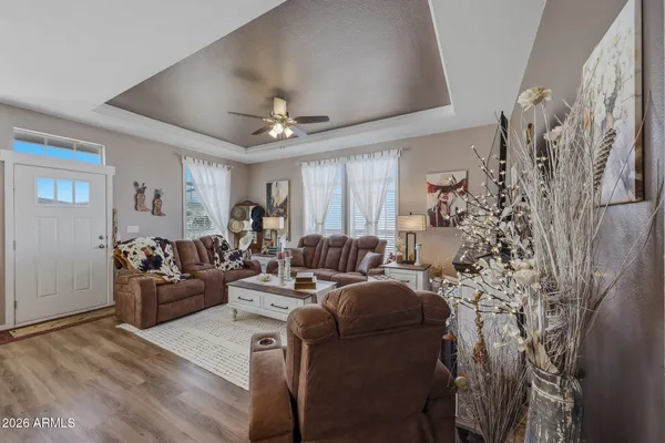 a living room with furniture and a bookshelf