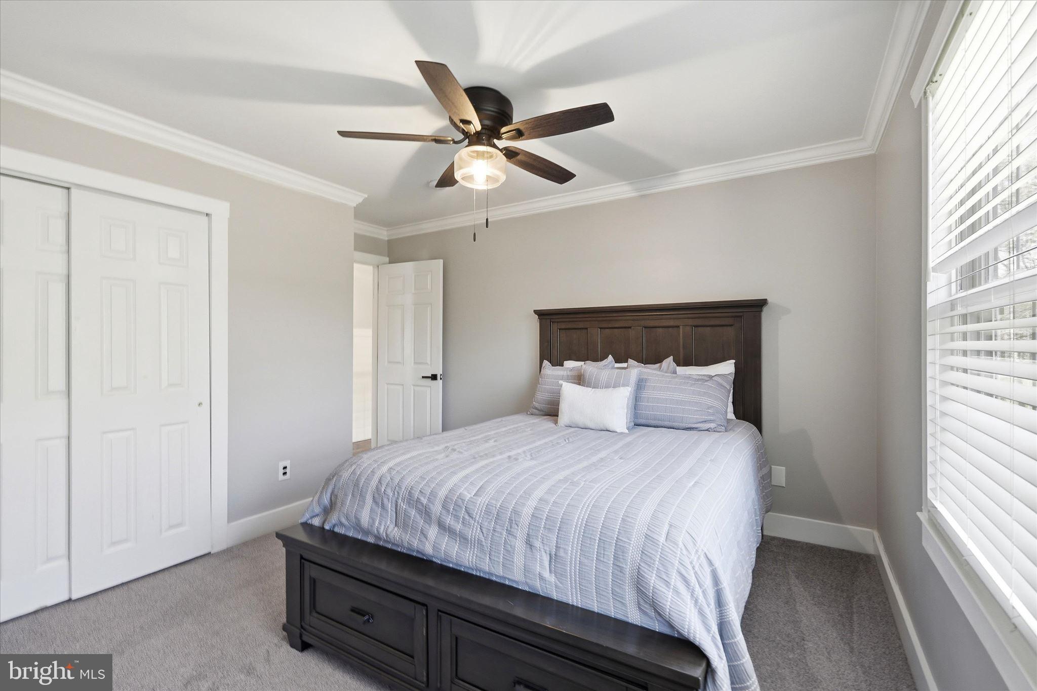 176 Warren Grove Road Barnegat, NJ 08005 - Photo 39 of 71 a bedroom with a large bed and a window