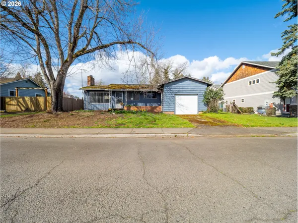 a house with trees in the background
