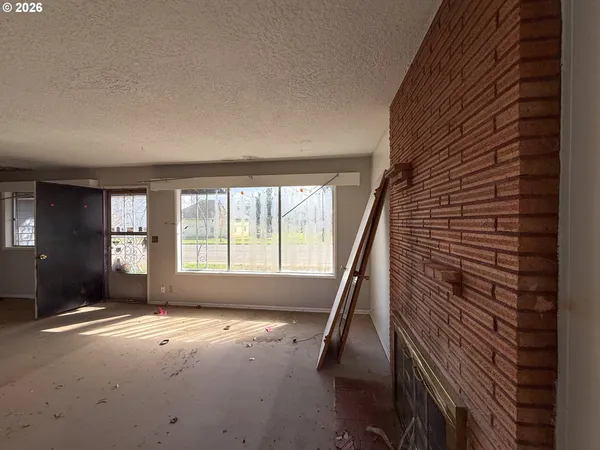 a view of room with furniture and wooden floor