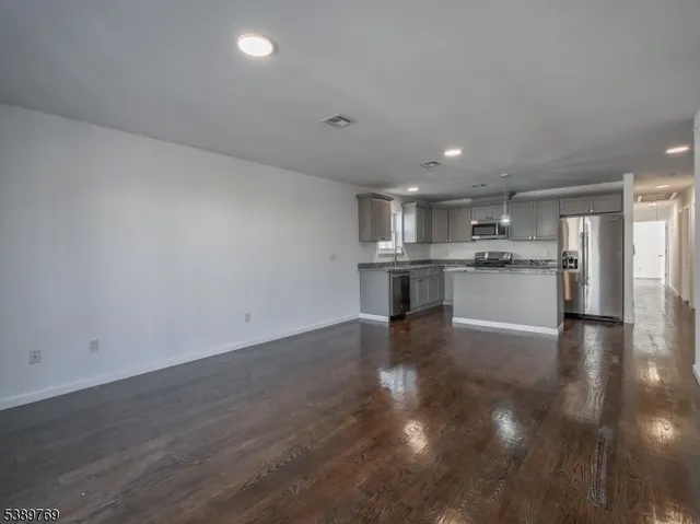 a view of kitchen with wooden floor