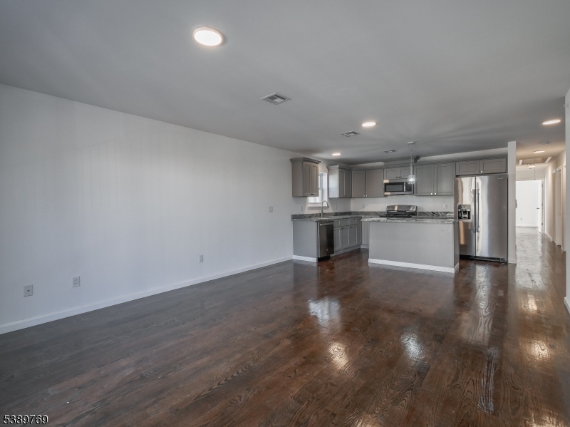 496 South 18th Street Newark, NJ 07103 - Photo 8 of 14 a view of kitchen with wooden floor