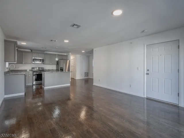 a view of kitchen with wooden floor