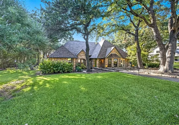 a view of house with outdoor space and garden