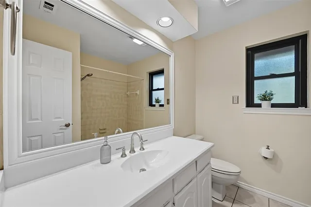 a bathroom with a bathtub and shower