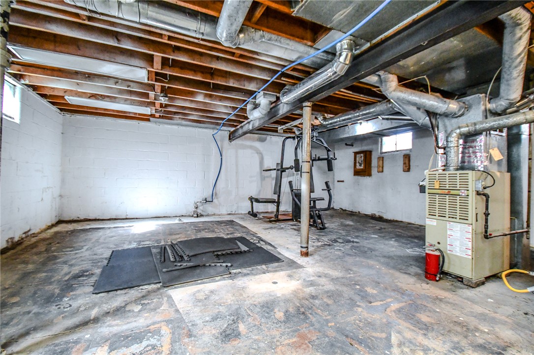 816 South Smithville Road Dayton, OH 45403 - Photo 25 of 33 This spacious unfinished basement offers ample room for future expansion and customization.