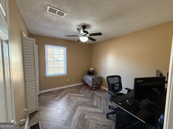 a workspace with furniture and chandelier