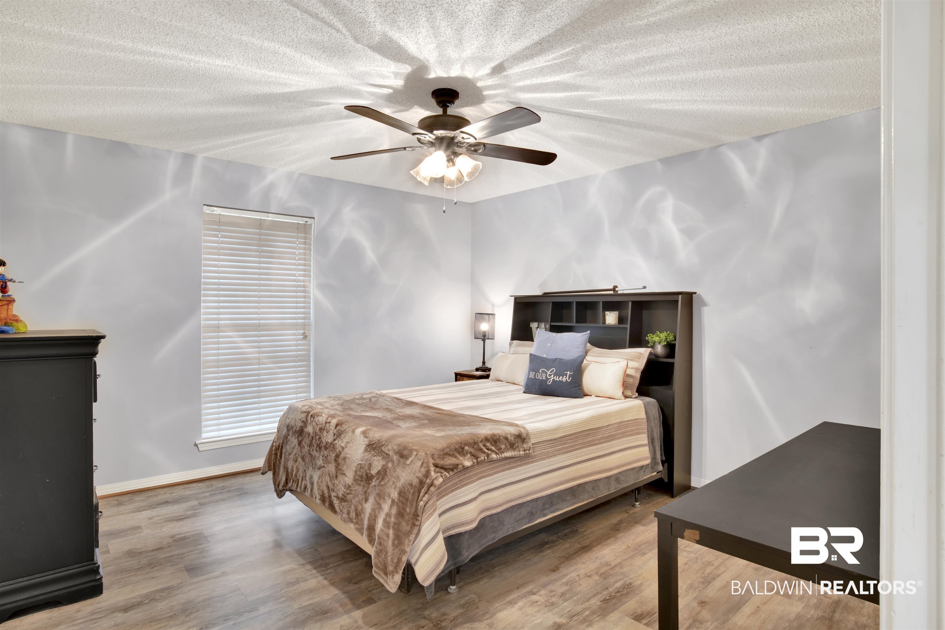 13385 Tom Gaston Road Mobile, AL 36695 - Photo 20 of 42 Bedroom with a textured ceiling, hardwood / wood-style floors, and ceiling fan