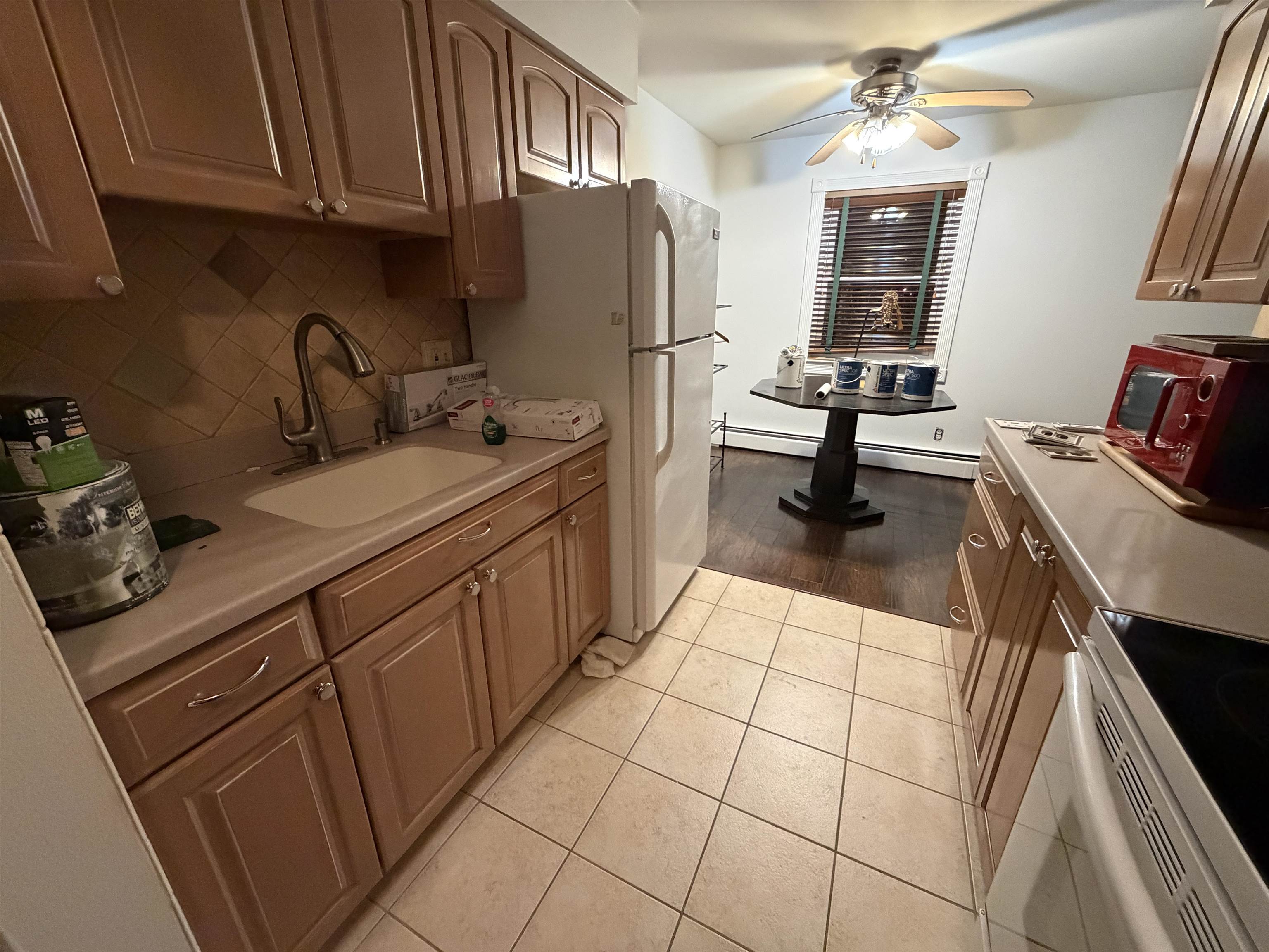2 Radio Avenue, Unit A15 Secaucus, NJ 07094 - Photo 3 of 9 a kitchen with a sink appliances and cabinets
