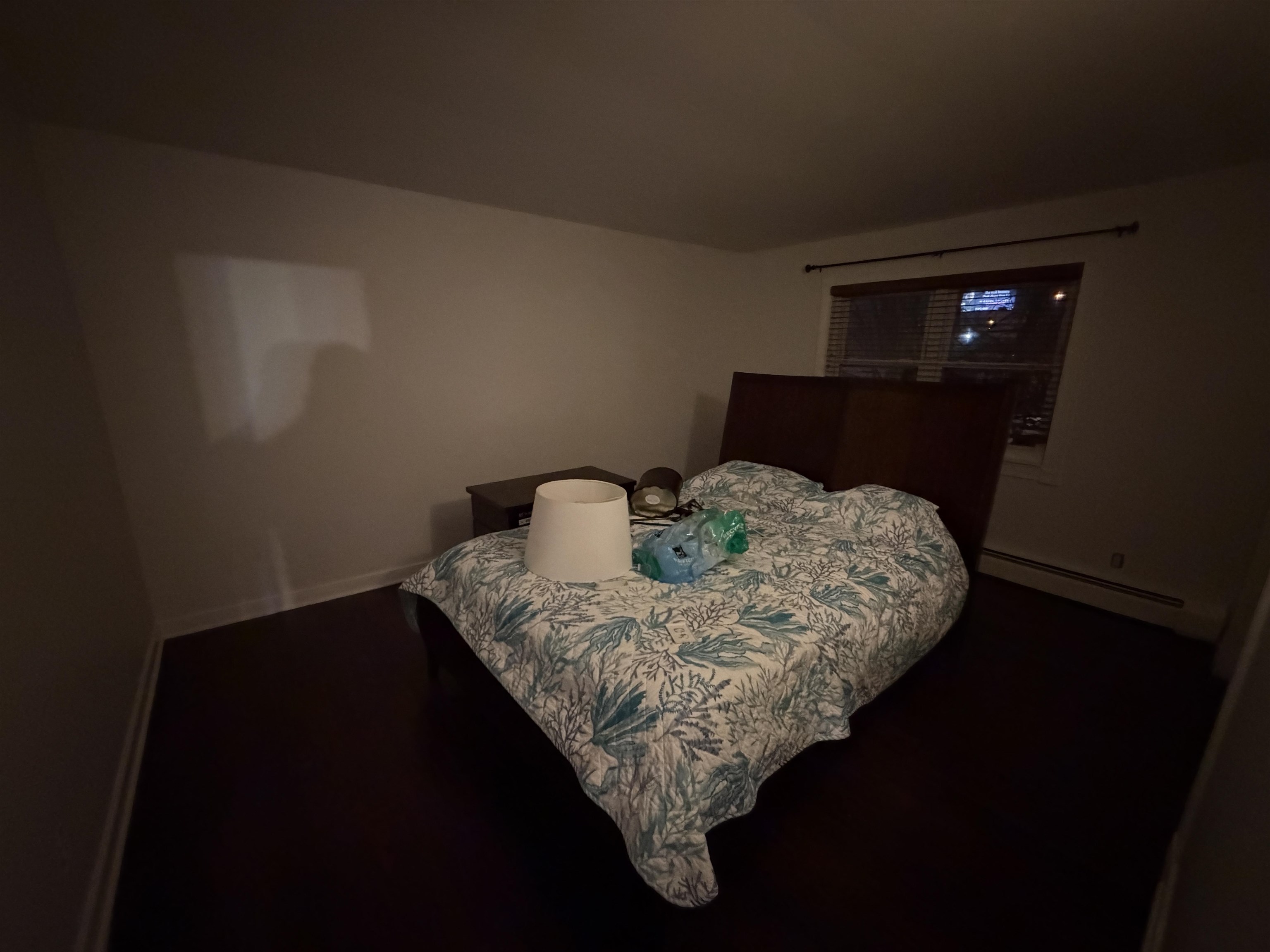 2 Radio Avenue, Unit A15 Secaucus, NJ 07094 - Photo 6 of 9 a bed sitting in a bedroom next to a window