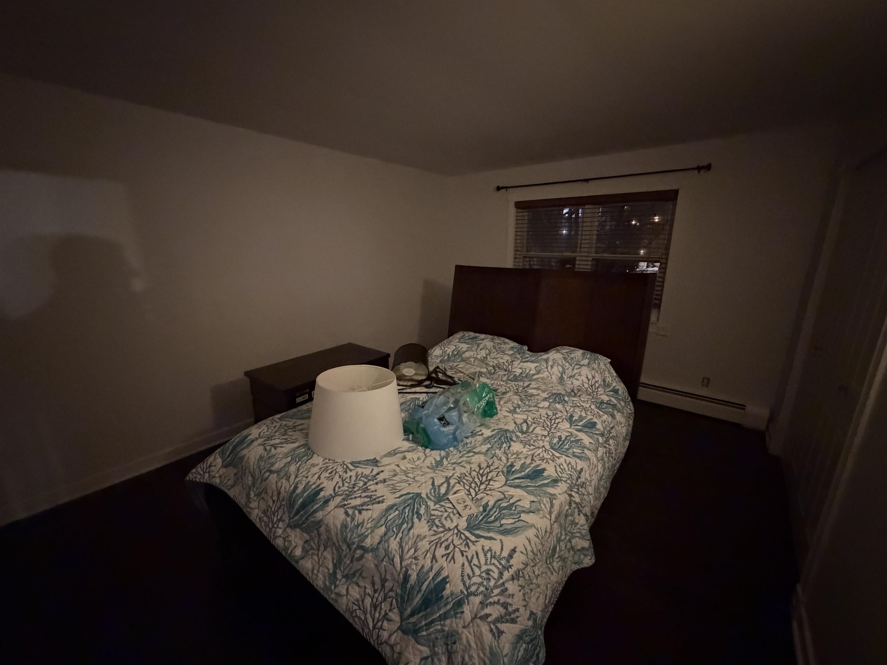 2 Radio Avenue, Unit A15 Secaucus, NJ 07094 - Photo 8 of 9 a bed sitting in a bedroom next to a window with kitchen