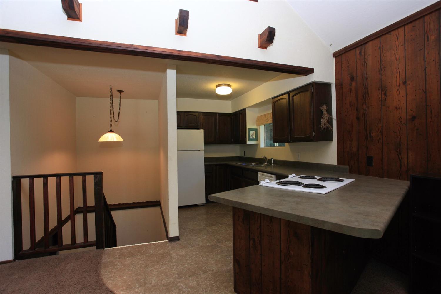 12093 Galice Road Merlin, OR 97532 - Photo 14 of 26 a kitchen with a sink appliances and cabinets