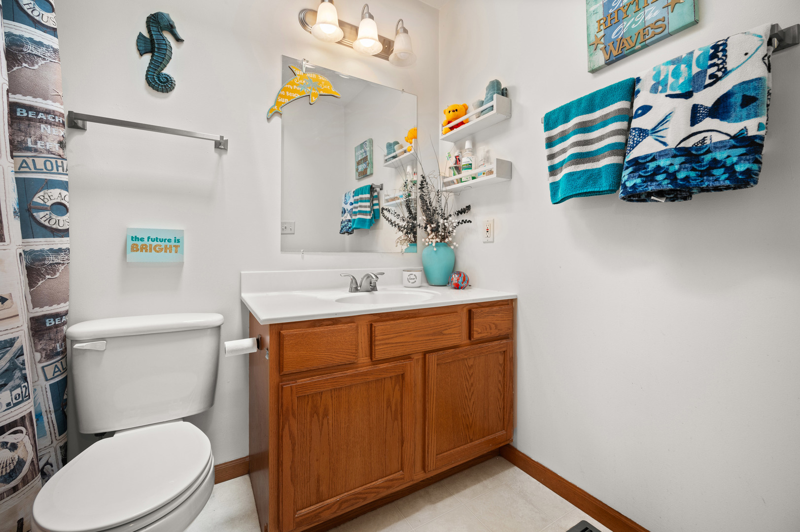 720 Hawthorne Lane Genoa, IL 60135 - Photo 15 of 25 a bathroom with a toilet sink and mirror