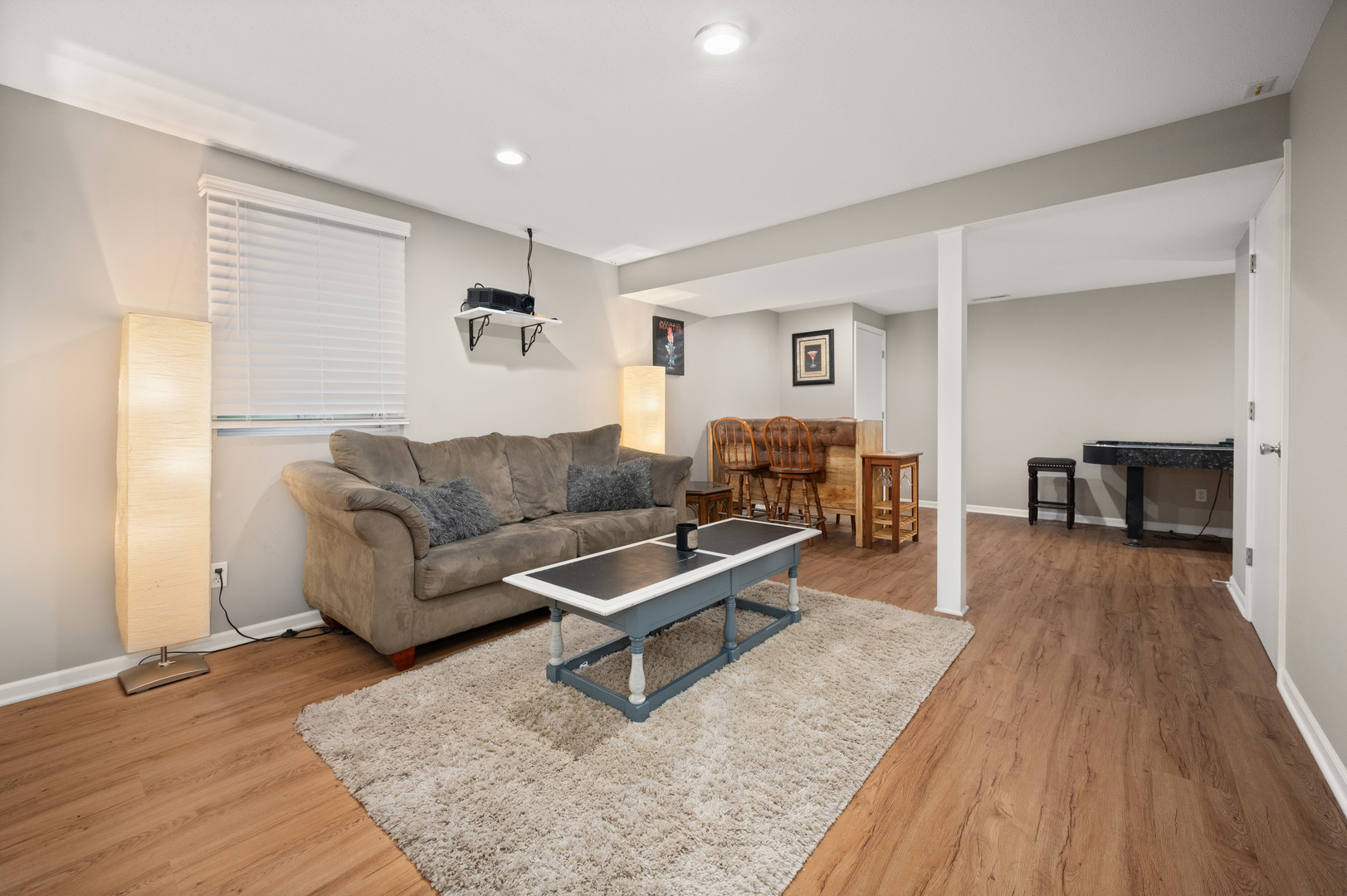 720 Hawthorne Lane Genoa, IL 60135 - Photo 16 of 25 a living room with furniture and a wooden floor