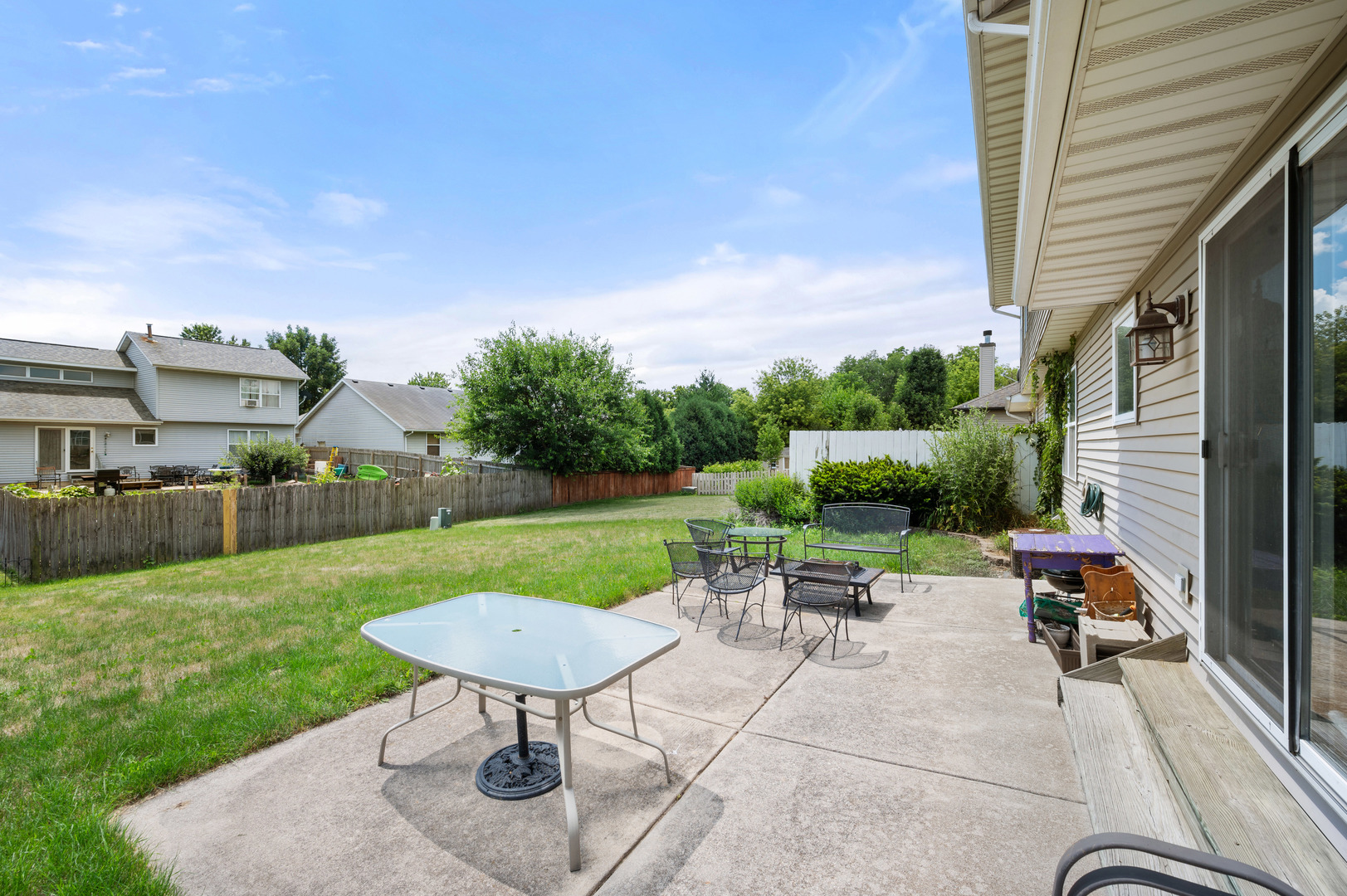 720 Hawthorne Lane Genoa, IL 60135 - Photo 22 of 25 a view of a backyard with sitting area