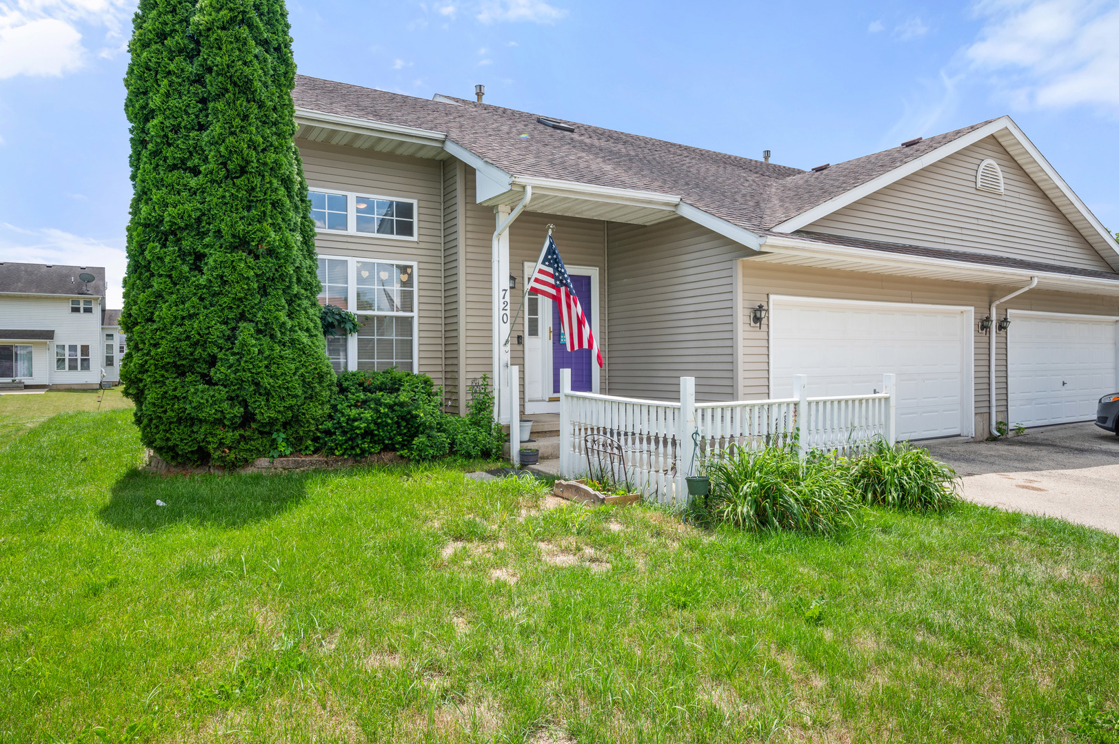 720 Hawthorne Lane Genoa, IL 60135 - Photo 25 of 25 front view of a house with a yard