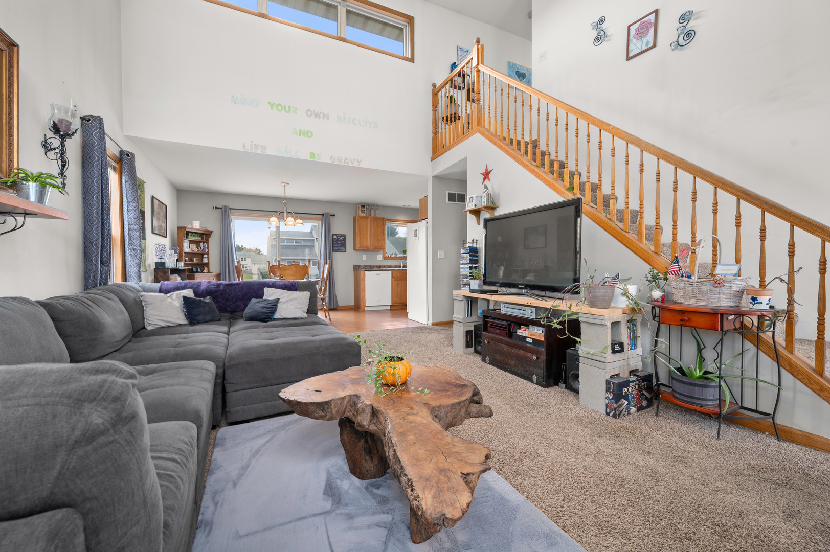 720 Hawthorne Lane Genoa, IL 60135 - Photo 5 of 25 a living room with furniture and a flat screen tv