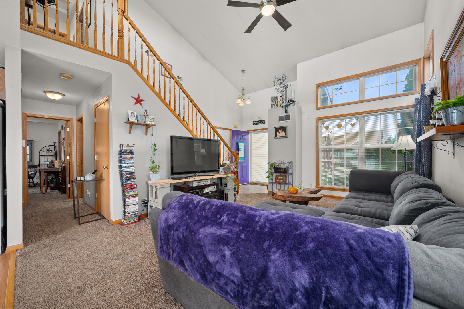 720 Hawthorne Lane Genoa, IL 60135 - Photo 6 of 25 a living room with furniture and a flat screen tv