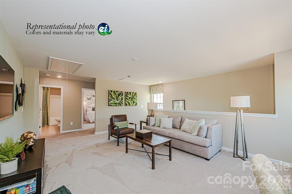 6587 Gopher Road, Unit 343 Lancaster, SC 29720 - Photo 11 of 19 a living room with furniture and a lamp