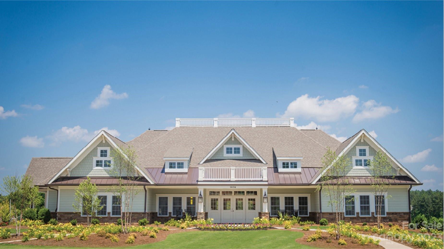 6587 Gopher Road, Unit 343 Lancaster, SC 29720 - Photo 15 of 19 a front view of a residential houses with yard and buildings in the background