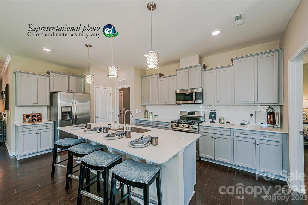 6587 Gopher Road, Unit 343 Lancaster, SC 29720 - Photo 2 of 19 a kitchen with refrigerator cabinets and wooden floor