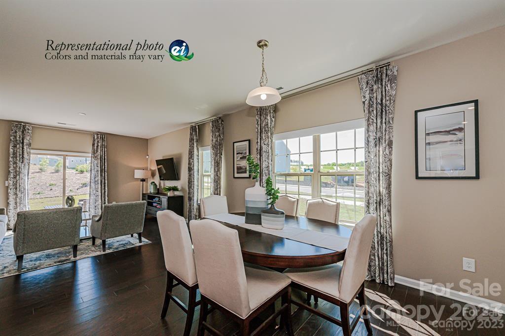 6587 Gopher Road, Unit 343 Lancaster, SC 29720 - Photo 4 of 19 a view of a dining room with furniture window and wooden floor