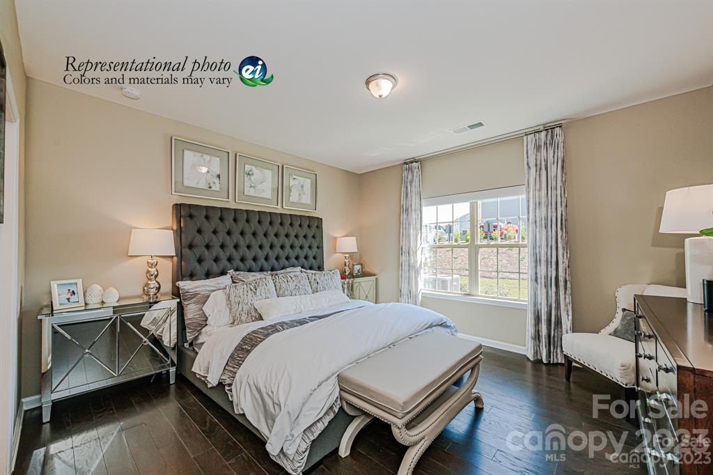 6587 Gopher Road, Unit 343 Lancaster, SC 29720 - Photo 7 of 19 a bedroom with a bed and wooden floor