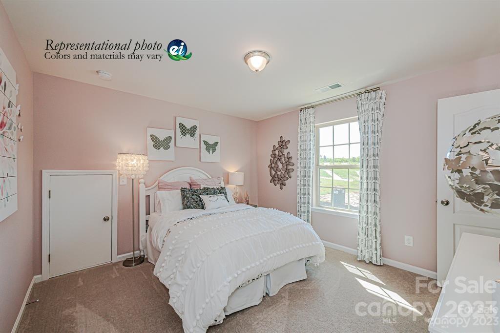 6587 Gopher Road, Unit 343 Lancaster, SC 29720 - Photo 9 of 19 a bedroom with a bed and a window